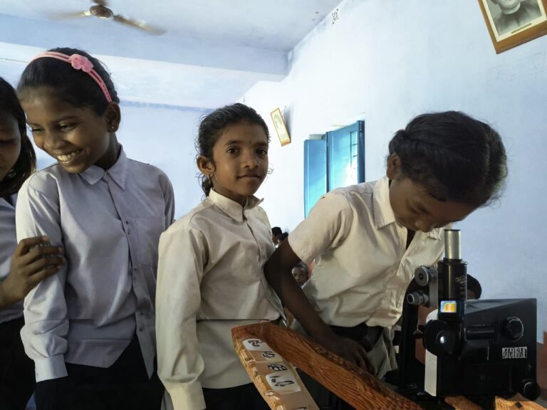 Litmas girls using microscope